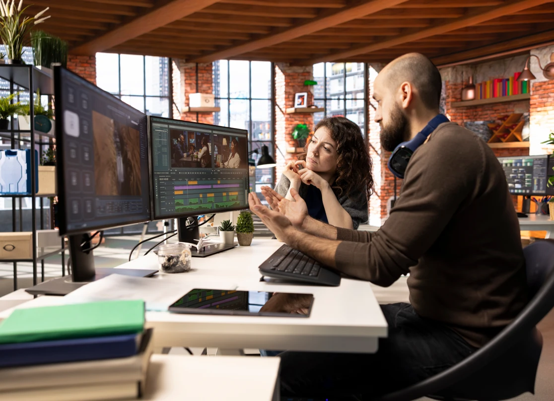 Video editing team discussing project