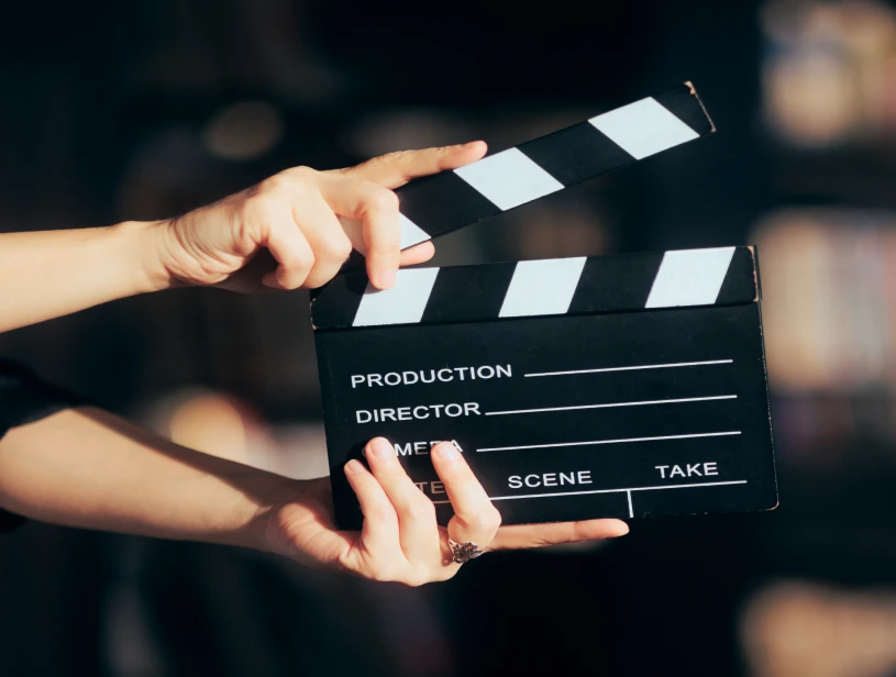 Hands holding movie slate for scene