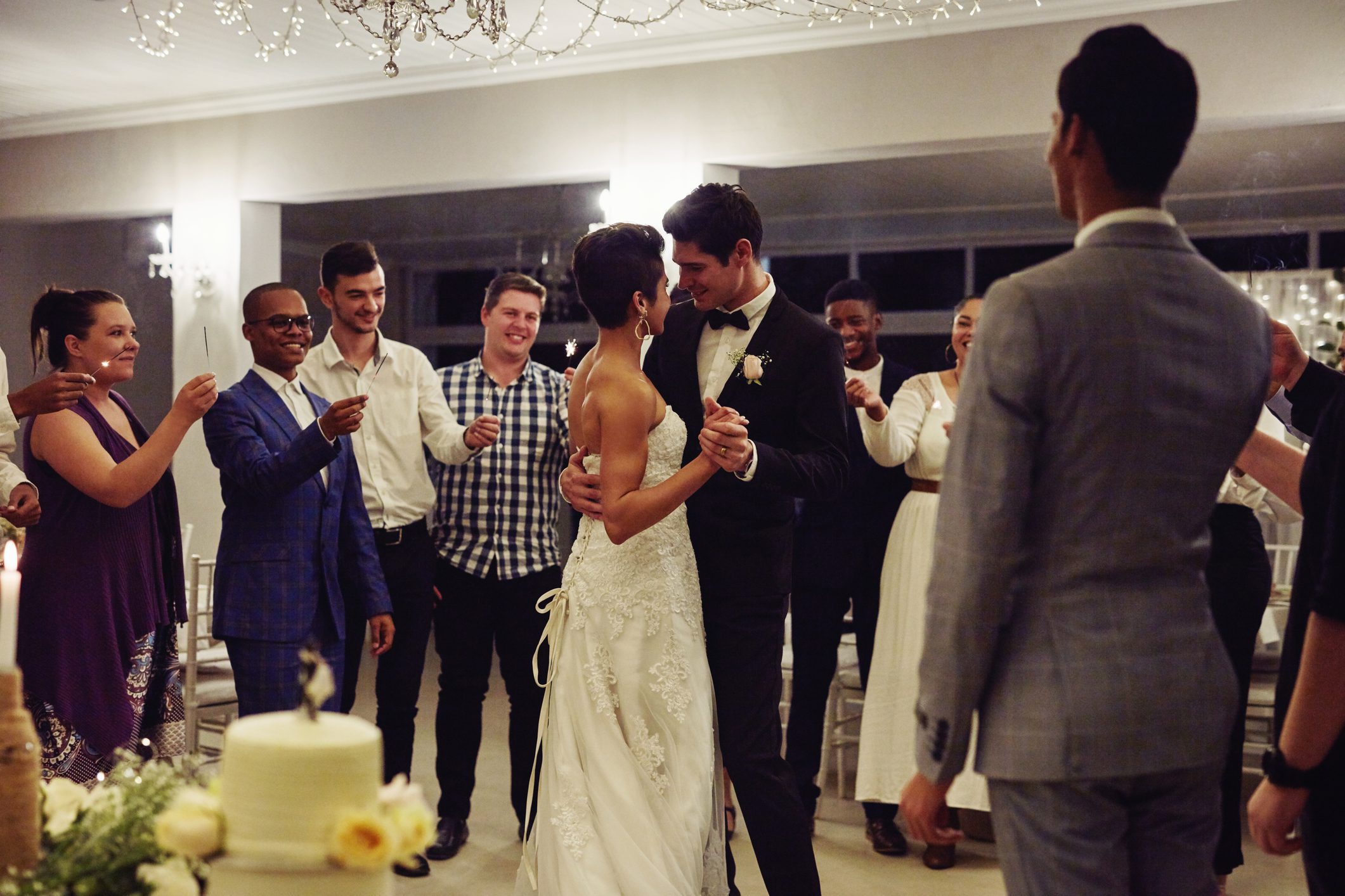 Bride and groom dancing at wedding reception.